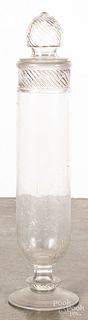 Tall country store colorless glass show jar