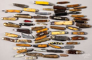 Approximately sixty folding pocket knives