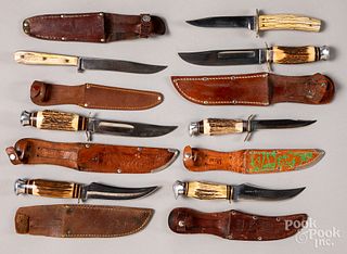 Seven fixed blade hunting knives and sheaths