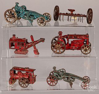 Five small cast iron toys
