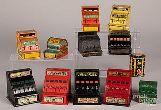 Twelve tin toy cash registers