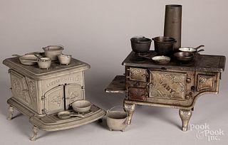Two cast iron toy stoves