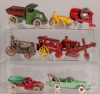 Eight small cast iron vehicles