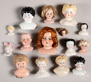 Fifteen bisque, tin and composition doll heads