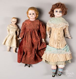 Three wax dolls