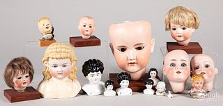 Sixteen bisque, tin and composition doll heads