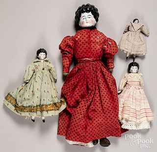 Four bisque molded hair dolls