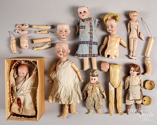 Group of bisque head doll heads and parts