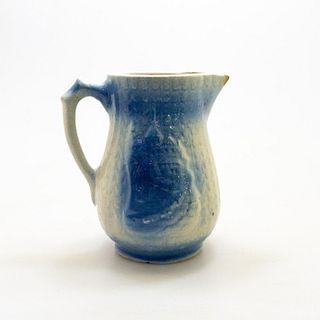 Blue salt glaze pitcher with village scene