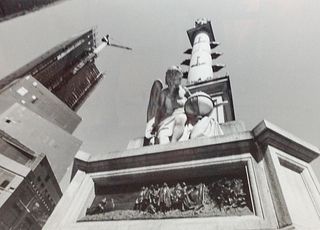 Black and White Photo of Statue Angel of building