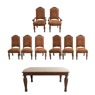 Comedor. Siglo XX. En talla de madera. Consta de: Mesa, 6 sillas y 2 sillones. Mesa con sistema de extensiones y extensiones. Pzs: 9