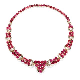 A silver, 18K yellow gold, diamond and ruby necklace