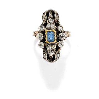 A silver, low-carat gold, sapphire and diamond ring
