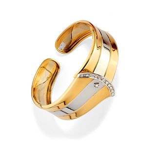 A 18K two-color gold and diamond bangle, with box