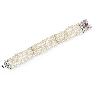 A 18K white gold, cultured pearl and ruby bracelet, defects