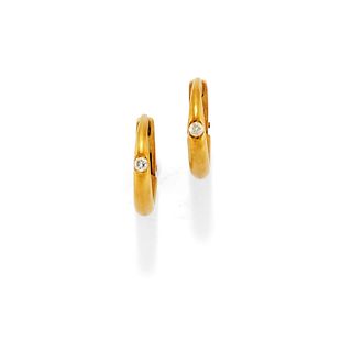 Pomellato - A 18K yellow gold and diamond earclips, Pomellato