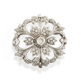 A 18K white gold and diamond brooch, defects