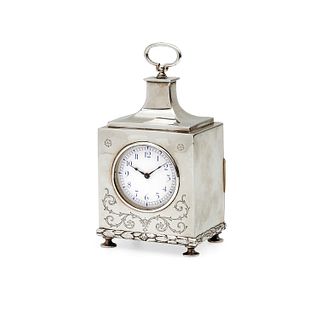 A silver clock, England 20th Century