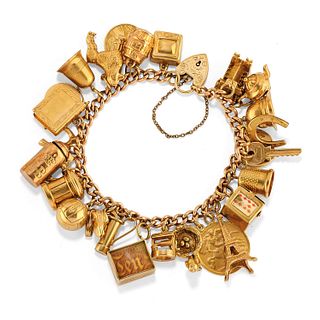 A 9K yellow gold charms bracelet, circa 1950