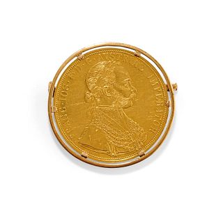 A 18K yellow gold and coin brooch
