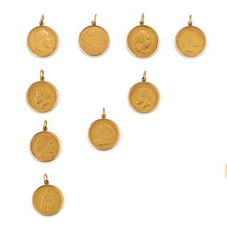 Nine 18K yellow gold and coins pendants