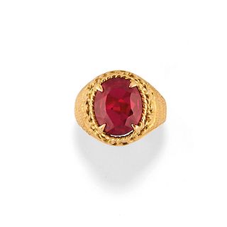 A 18K yellow gold and red gemstone ring