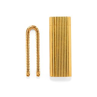 A 18K yellow gold and gilded metal lighter by Cartier and a money clip 