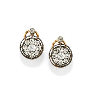 A silver, 18K yellow gold and diamond earclips