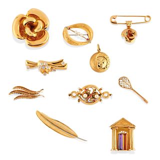 Nine 18K yellow gold and colored gemstone brooches, one in low-carat gold