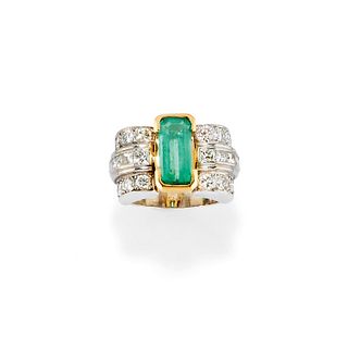 A platinum, 18K yellow gold, emerald and diamond ring