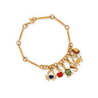 A 18K yellow gold and enamel charms bracelet