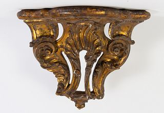 Consola rinconera Carlos IV en madera tallada y dorada. España, finales del siglo XVIII.