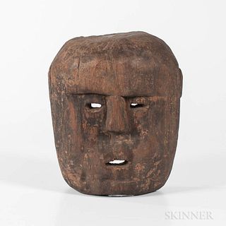Timor Mask, early 20th century, large wood mask with cutout eyes and mouth, two holes pierced for wearing, ht. 11 1/2, wd. 10 in.