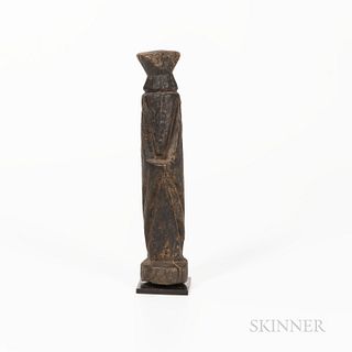 Dogon Figure, hardwood, abstracted human figure, legs, arms and head defined by broad cutout grooves in the wood, with dry encrusted pa