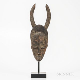 Urhobo Mask, Nigeria, the elongated face with open mouth, elongated nose, semi-closed pierced eyes, high forehead, with two horns at cr