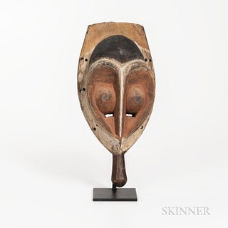Yaka Mask, Democratic Republic of the Congo, handheld mask with cutout eyes in the heart-shaped abstract face, pigmented with kaolin, a