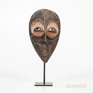 Goma Mask, Democratic Republic of the Congo, hollowed-out face mask, with small round protruding mouth below a raised, elongated nose,