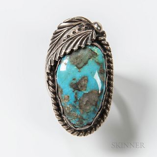 Large Navajo Silver and Turquoise Ring, attributed to Dan Lewis, the large turquoise stone with leaf and ropework bezel, ring size 11.