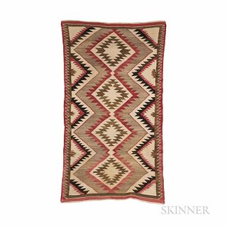 Navajo Chinle Rug, first quarter 20th century, woven with natural synthetic dyed homespun wool, with elaborate serrated geometric desig