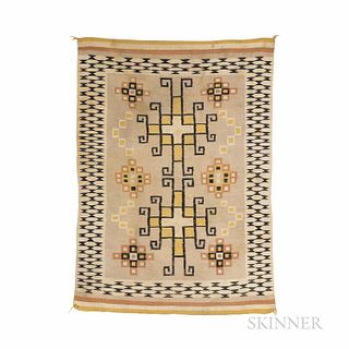 Navajo Rug, c. 1930s, the perimiter with flat hourglass design in black, the body with square star motifs and central double square sta