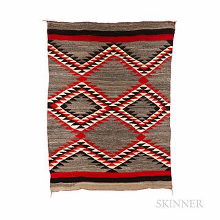 Navajo Transitional Textile, with a complex three-color serrated dazzler diamond motif in the central part of the textile, with double