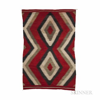 Navajo Ganado Rug, c. 1940s, with two large central serrated joined diamonds, framed by a three-band serrated zigzag on each side, in a