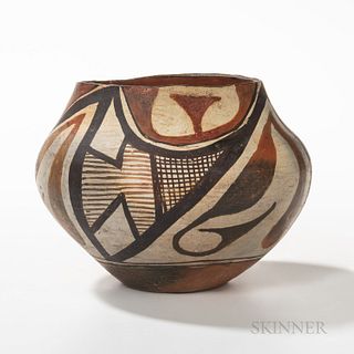 Southwest Polychrome Pottery Jar, Acoma, first quarter 20th century, the rim painted black, exterior decorated in two color repeated ab