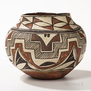 Acoma Polychrome Pottery Jar, decorated in two colors, with black rim, joined triangular motifs below, the shoulder with triple black b