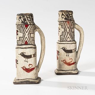 Two Southwest Polychrome Pottery Candlesticks, Zuni, each rising from a square base, made up of two rectangular sections, terminating i