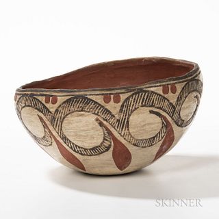 Southwest Polychrome Pottery Bowl, Isleta Pueblo, first quarter 20th century, red clay form painted on the outside with a band of red a