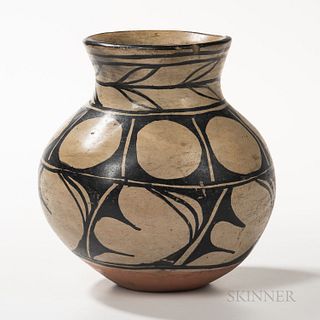 Santo Domingo Pottery Jar, unsigned, decorated with geometric and foliate designs in black on tan ground, (minor chip on rim), ht. 7 1/