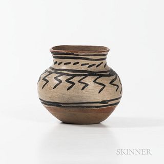 Small Tesuque Pottery Olla, early 20th century, decorated with black bands below the rim, and abstract lightning design around the midd