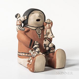 Cochiti Polychrome Pottery Storyteller Figure, signed "Helen Cordero, Cochiti, N. Mexico" on base, depicted seated in traditional attir