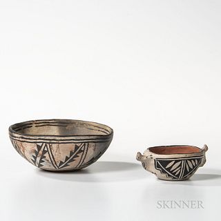 Two Cochiti Pottery Bowls, the larger bowl with abstract floral and geometric designs on a cream-colored slip, the smaller with two liz